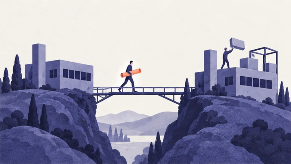 A figure carries a rolled blueprint across a footbridge between two hills, toward a second building being put together to match the first.